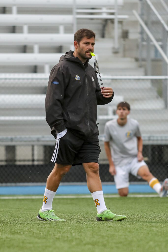 Rafael Martinez coaching the Kansas City Roos men's soccer team at UMKC
